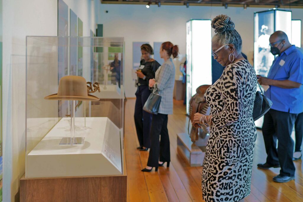 black cowboys exhibit with large crowd of people