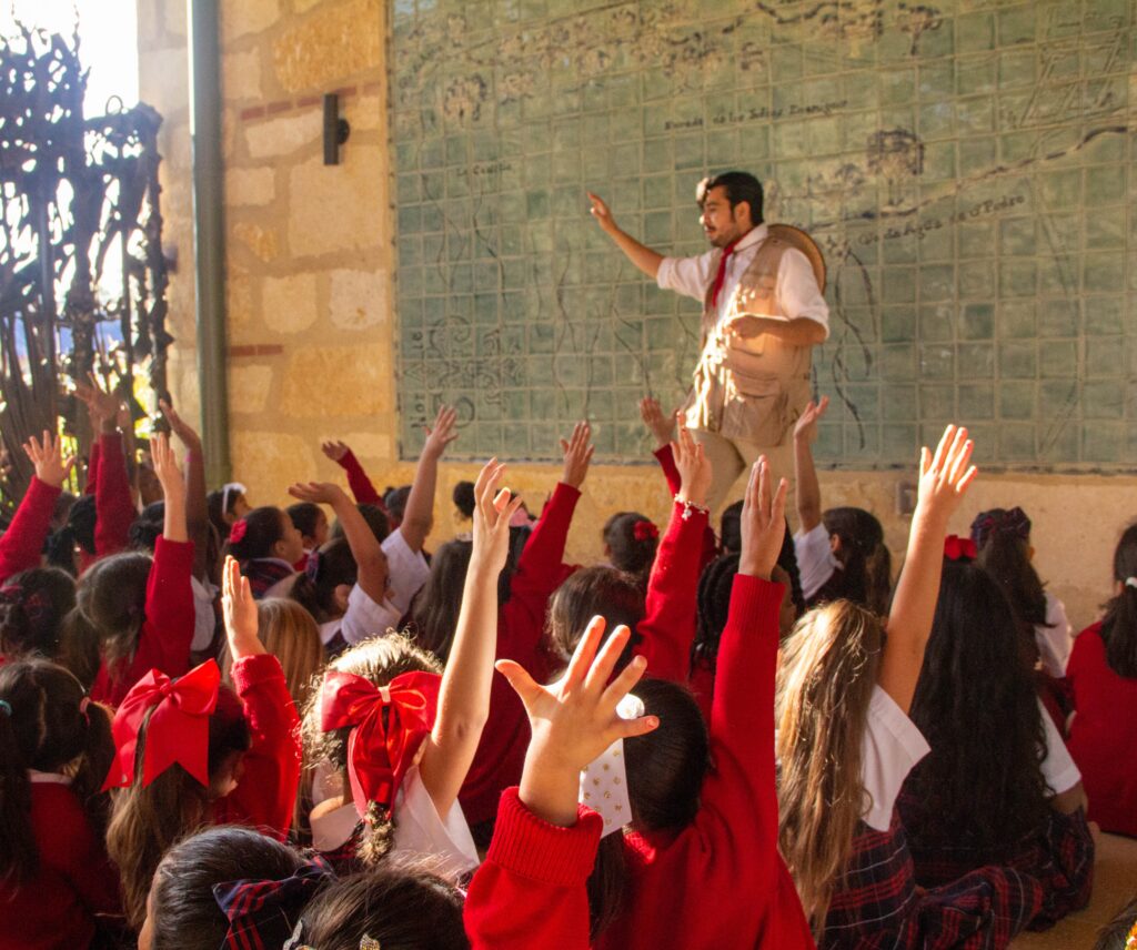 Field Trip Guide talking to audience of children