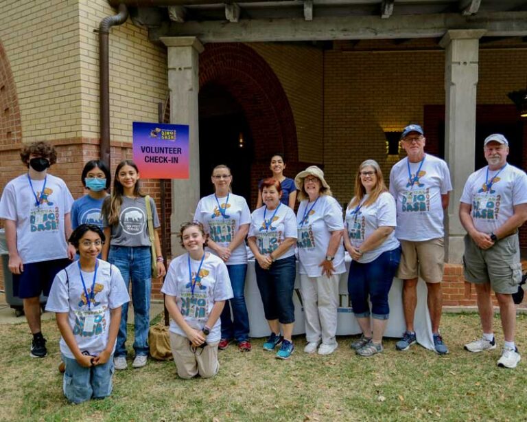 A group of volunteers at the Witte Museum helping with the Dino Dash and 5K race.