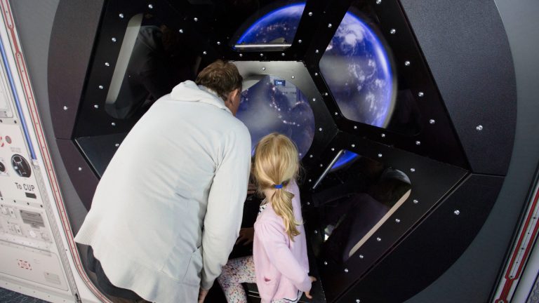 parent and child view Earth from space