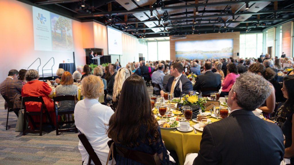 guests sit at tables during luncheon